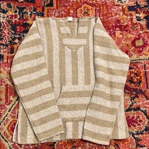 Tan and white striped pullover.